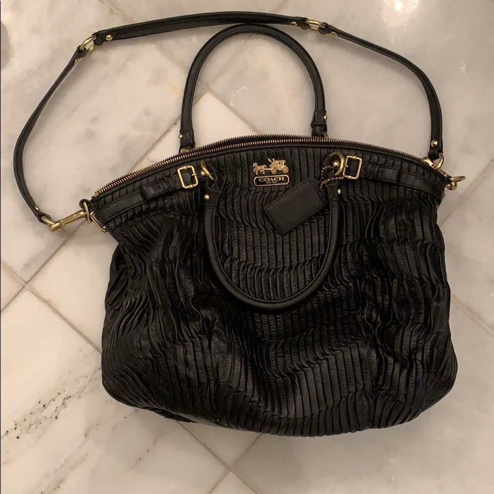Black leather with gold coach emblem purse